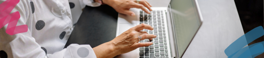 Someone typing on a laptop