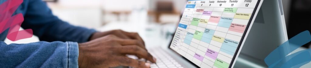Looking at a schedule on a laptop.
