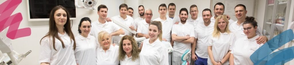 A dental team looking at the camera and smiling