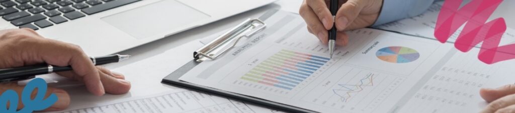 Person analyzing charts and graphs.