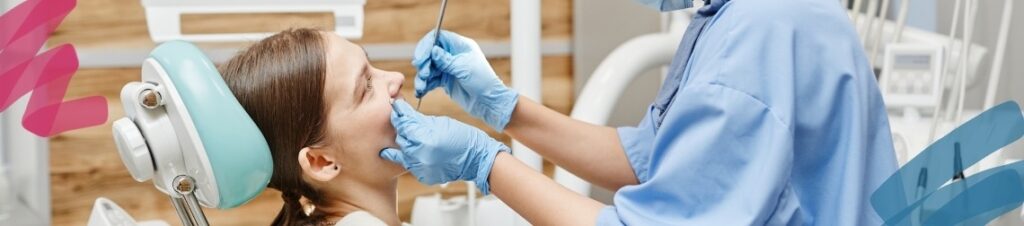 A dentist performing an exam on a patient.