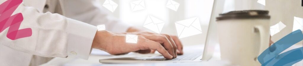 Person typing on a laptop with envelope graphics floating around.